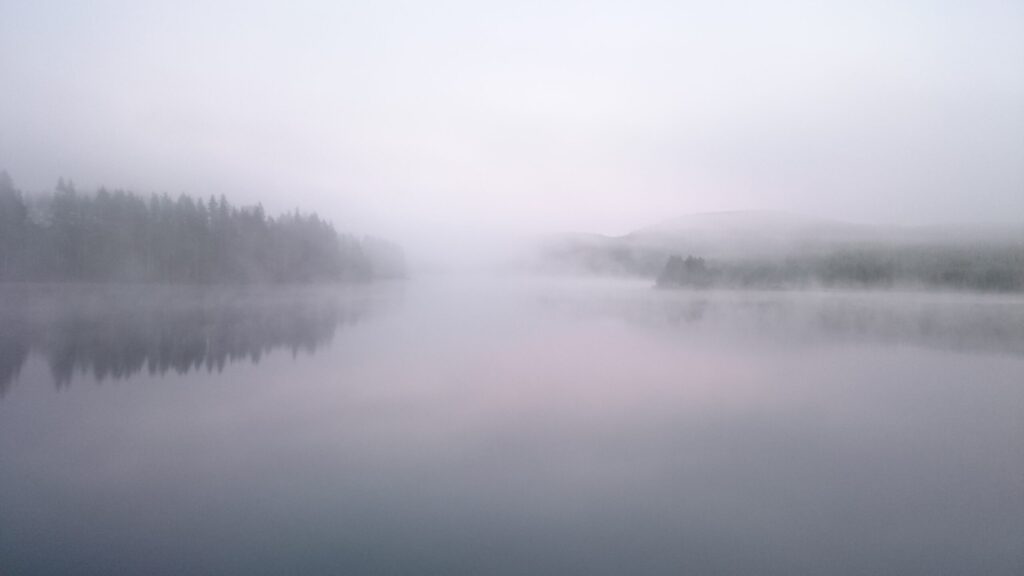Misty lake landscape symbolizing the reality and uncertainty of an early Print on Demand experiment.