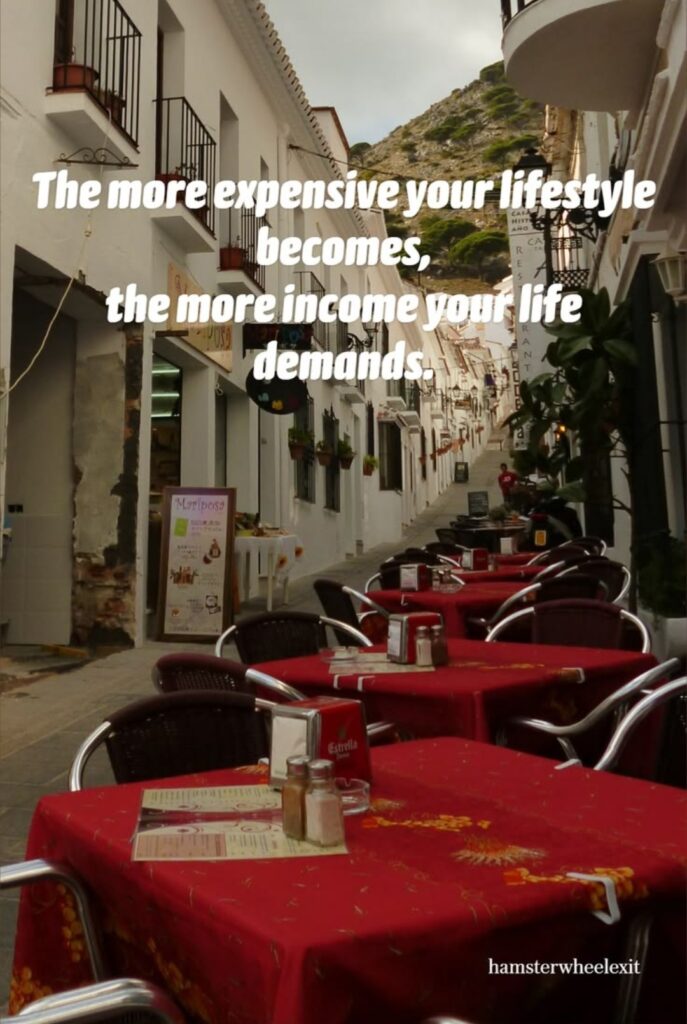Pinterest pin featuring a European street café with the quote: "The more expensive your lifestyle becomes, the more income your life demands."